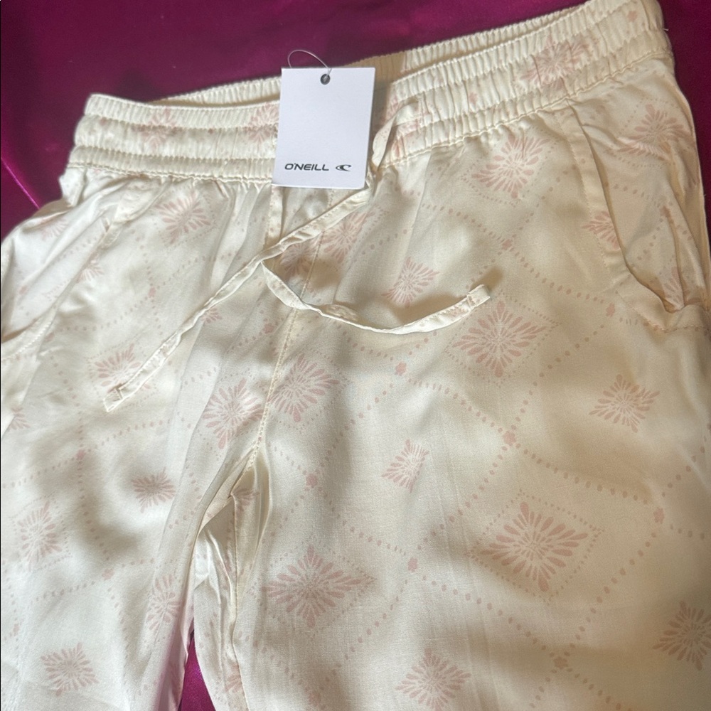 NWT O’Neill size small Cream Patterned Jogger Pants, pink scents 100% viscose
